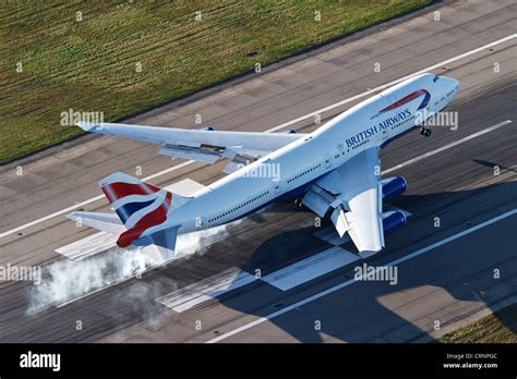 Aerial View Of A British Airways Boeing 747 Landing On Runway 27r At