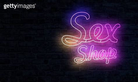 Sex Shop Neon Sign With Illumination Adult Store Symbol On Brick Wall