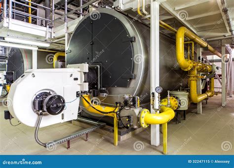 Interior Gas Boiler Room With Large Boilers And Burners Royalty Free