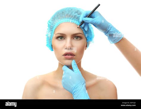 Plastic Surgeon Drawing Line On Female Face On White Background Stock