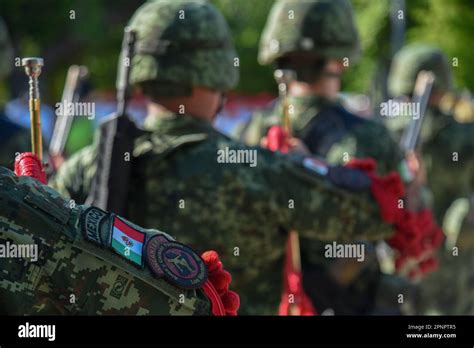 A Group Of Uniformed Mexican Military Personnel March In Formation