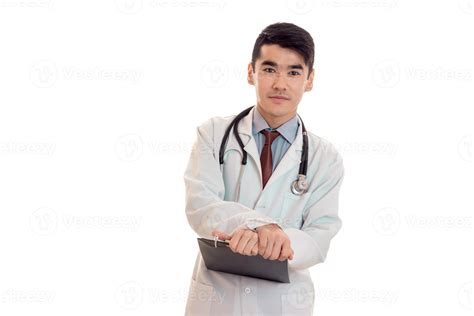 Studio Portrait Of Serious Male Doctor In Uniform Posing Isolated On