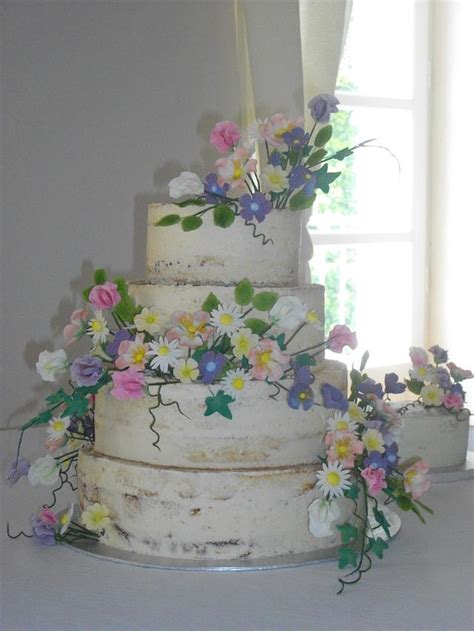 Naked Wedding Cake With Wild Flowers Decorated Cake CakesDecor