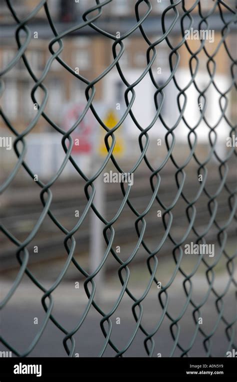 Green chain link fence Stock Photo - Alamy