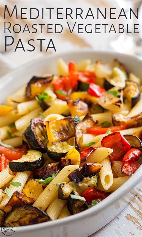 A White Bowl Filled With Pasta And Vegetables