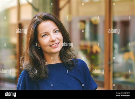 Outdoor Close Up Portrait Of Beautiful Mature 40 45 Year Old Woman With Brown Hair Stock Photo