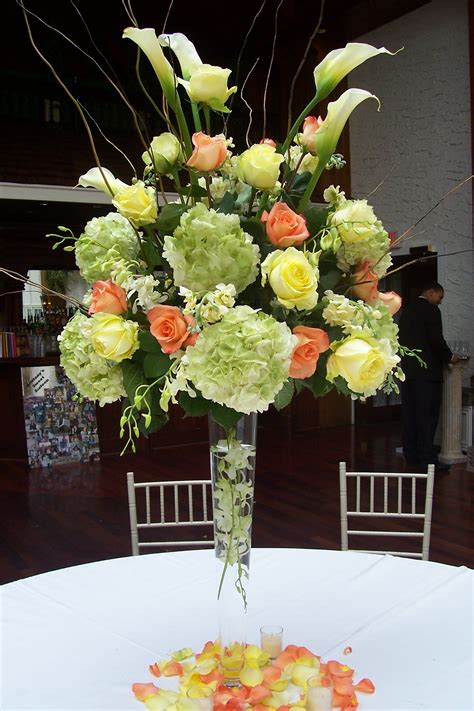 High Centerpieces Of Green Hydrangeas Calla Lilies And Colored Roses