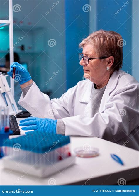 Senior Chemist Scientist Doing Experiment With Blood Stock Image