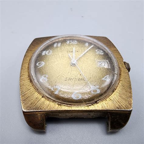 Mavin Vintage Timex Electric Watch Men Gold Tone Gold Woven Dial Date