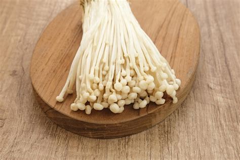 Premium Photo Enoki Mushrooms Jamur Enoki An Edible Mushroom With