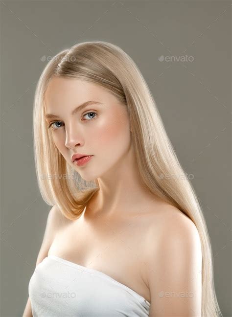 Beautiful Woman Face Portrait Beauty Skin Care Concept With Long Blonde Hair Over Gray