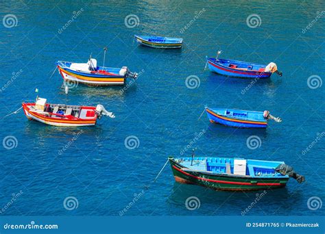 Colourful Fishing Boats On Sea Water In Camara De Lobos Port Madeira