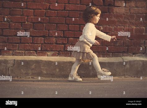 Little Girl Walking Away Stock Photo Alamy