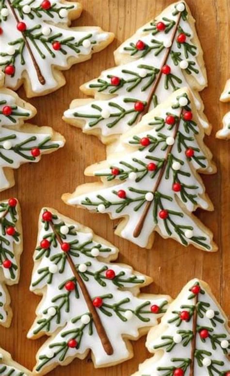 Decorated Christmas Tree Cookies On A Wooden Table