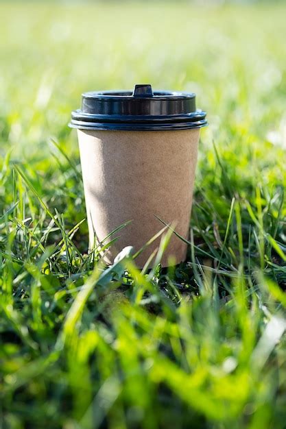 Premium Photo Mock Up To Go Coffee Cup Against Green Grass Disposable