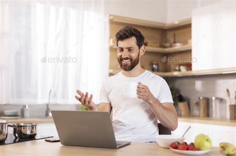 Smiling Mature Caucasian Male With Beard In White T Shirt Has Video