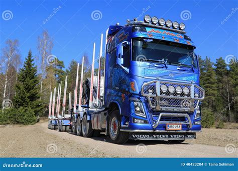 Blue Volvo FH16 750 Timber Truck On Rural Road Editorial Stock Image