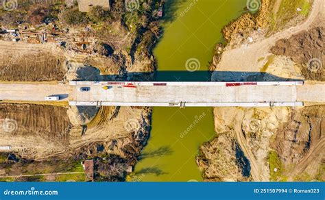 Aerial View On Road Over River Under Construction Building The Bridge