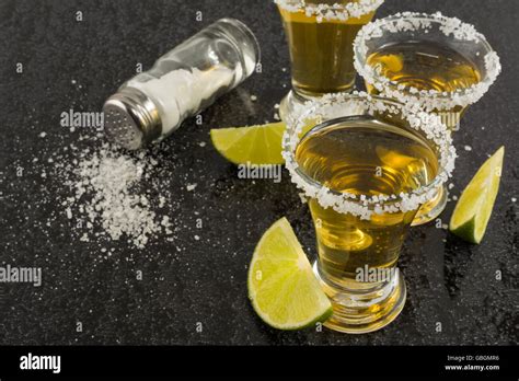 Gold Tequila Shots With Lime On Black Background Gold Mexican Tequila Tequila Shot Tequila