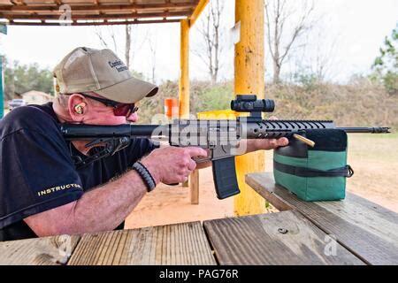 Hunter Looking Through Scope Of Rifle Stock Photo Alamy