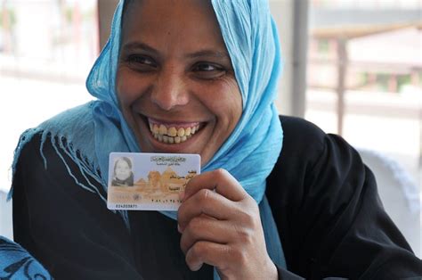 Happiness Appears On The Face Of An Egyptian Woman Who Received Her