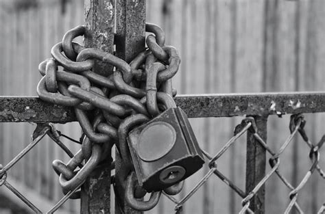 Premium Photo Close Up Of Chain With Padlock On Metal Fence