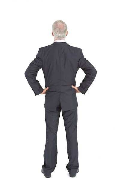 Premium Photo Rear View Of Serious Mature Businessman Posing