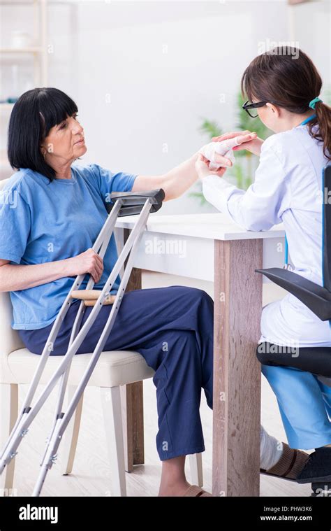 Doctor Examining Old Mature Woman After Incident Stock Photo Alamy