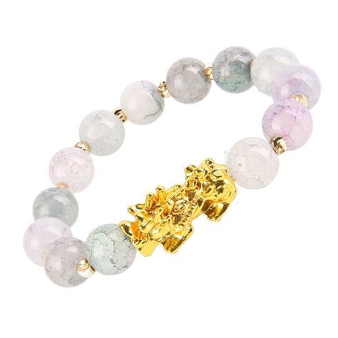 A Bracelet With Two Gold Charms And Multicolored Beads On It S Side