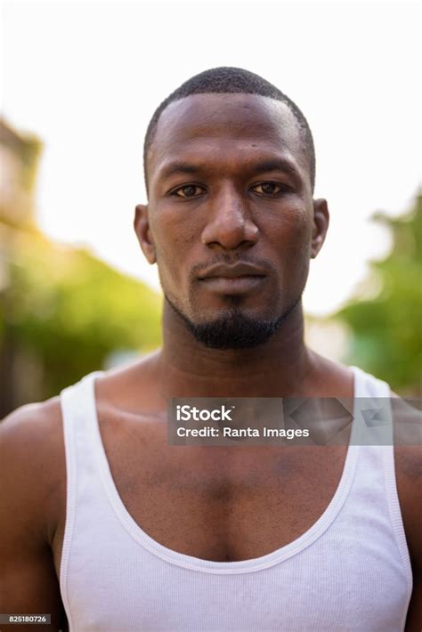 Portrait Of Muscular Handsome African Man Wearing Tank Top Outdoors