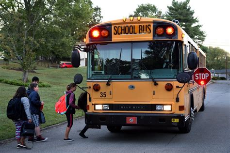 Note to Motorists: A stopped school bus with lights flashing; stop arm & stop sign activated ...