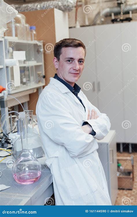 Scientist Conducts Chemical Experiments With Liquids In The Medical