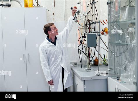 Scientist Conducts Chemical Experiments In The Laboratory Stock Photo