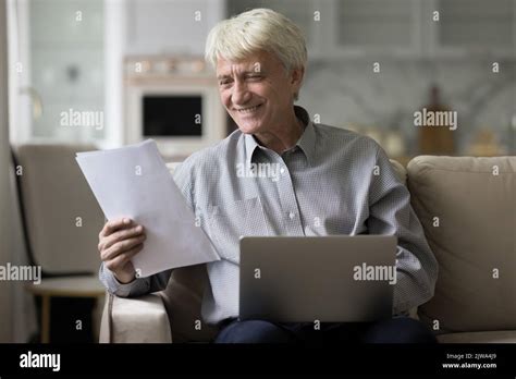 Happy Mature Grey Haired Man Working From Home Stock Photo Alamy