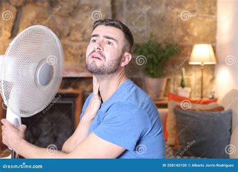 Man During Unbearable Heatwave Using Electric Fan Stock Photo Image