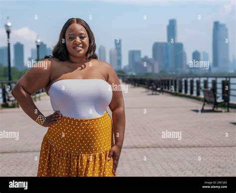 Chubby African American Black Woman On The Boardwalk Outdoors Stock