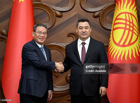 Kyrgyz President Sadyr Japarov shake hands with the Chinese Premier ...