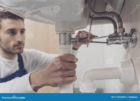 Plumber Fixing A Sink At Home Stock Image Image Of Service