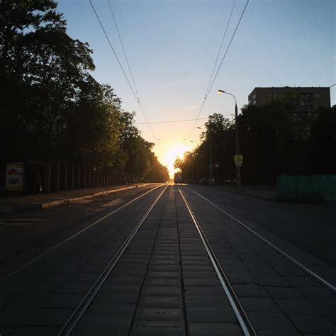 Premium Photo | Railroad tracks at sunset