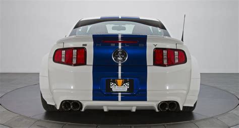 The Rear End Of A White And Blue Mustang