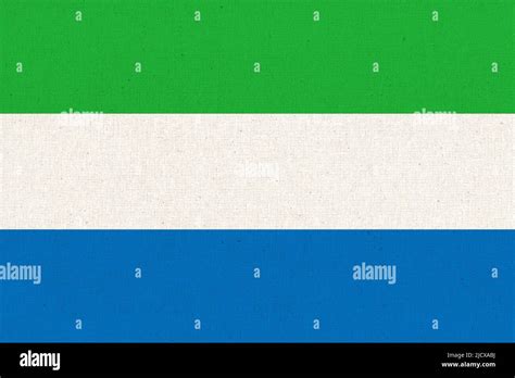 Flag of Sierra Leone. Sierra Leone flag on fabric surface. Fabric ...