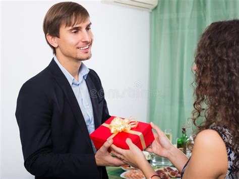 Smiling Man Giving Present To Beautiful Woman Stock Photo Image Of