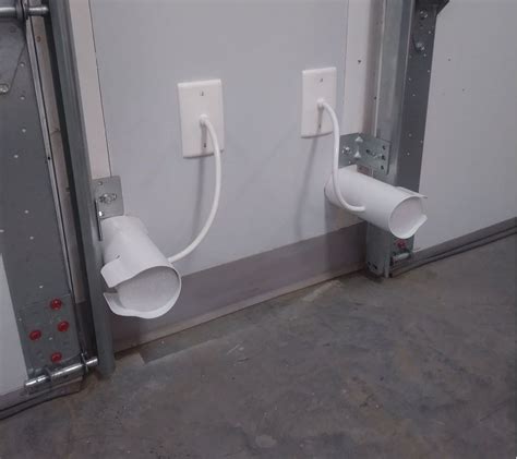 Two White Wall Mounted Urinals Next To Each Other In A Room With