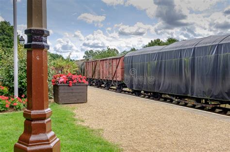 View Of Old Fashioned Covered Cargo Vans And Wagons Seen Disembarking