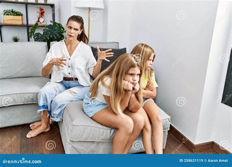 Mother And Daughters Angry For Sisters Problem At Home Stock Image