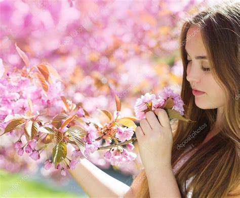 Girl smelling flowers — Stock Photo © halfpoint #45595011