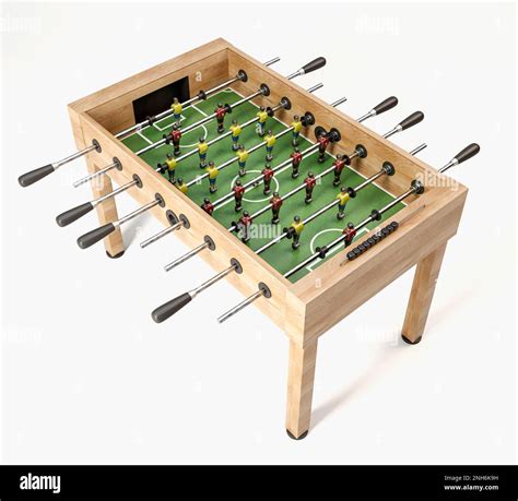 A Vintage Wooden Foosball Table With Detailed Metal Player Figurines In