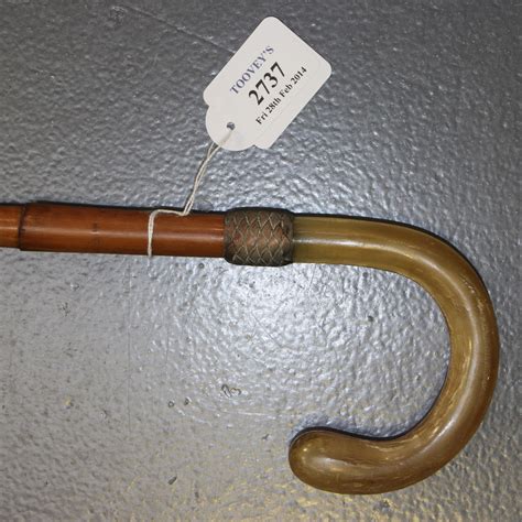 A Late Victorian Bamboo Riding Crop With A Carved Rhino Horn Handle