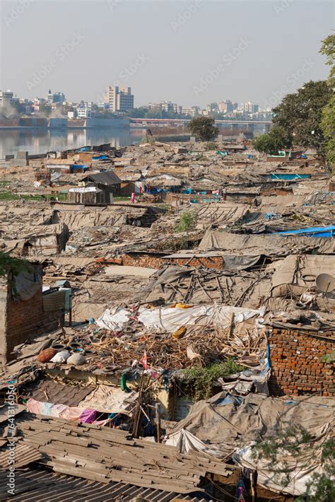 Slums In The Foreground And Modern High Rises Buildings Across The