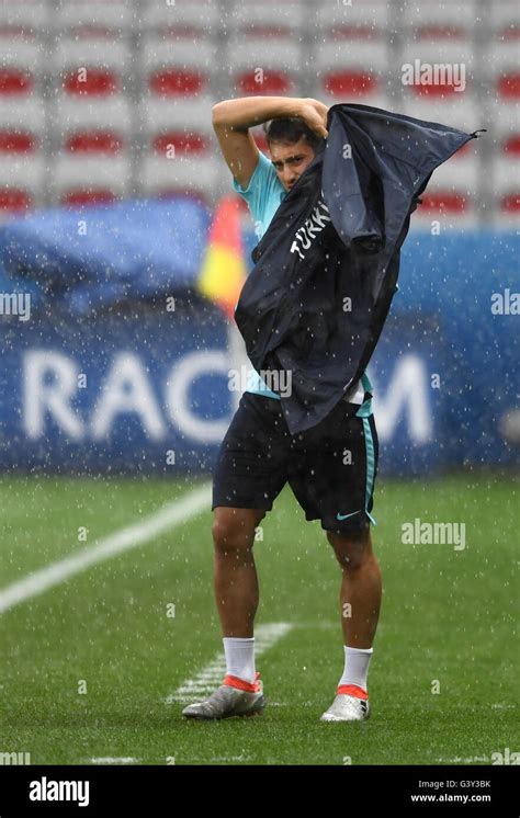 Hakan Calhanoglu Of Turkey Leaves The Pitch As Rain Begins To Fall